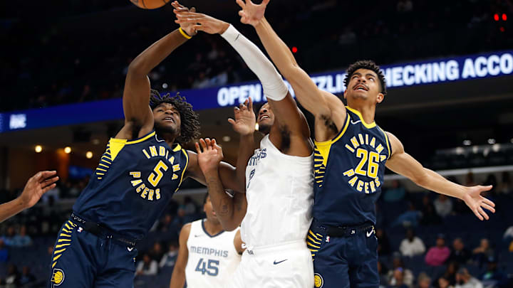 Oct 8, 2023; Memphis, Tennessee, USA; Indiana Pacers forward Jarace Walker (5), Memphis Grizzlies forward Xavier Tillman (2) and Indiana Pacers guard Ben Sheppard (26) battle for a rebound during the second half at FedExForum. Mandatory Credit: Petre Thomas-Imagn Images