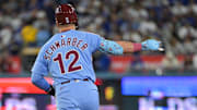 Oct 8, 2025; Los Angeles, California, USA; Philadelphia Phillies designated hitter Kyle Schwarber (12) celebrates after hitting a two run home run during the eighth inning against the Los Angeles Dodgers during game three of the NLDS round for the 2025 MLB playoffs at Dodger Stadium. Mandatory Credit: Jayne Kamin-Oncea-Imagn Images