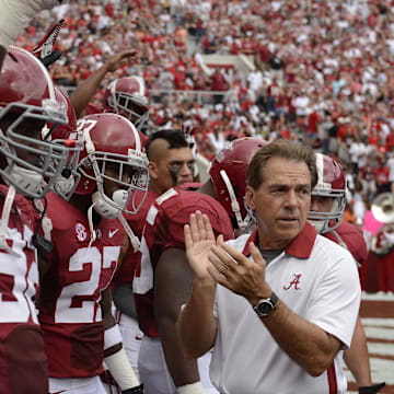 September 8, 2012; Tuscaloosa, AL, USA;  Alabama Crimson Tide head coach Nick Saban leads his players onto the field before the start of their game against the Western Kentucky Hilltoppers at Bryant Denny Stadium. 