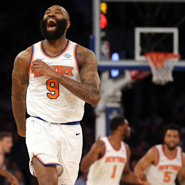 Apr 6, 2018; New York, NY, USA; New York Knicks center Kyle O'Quinn (9) reacts after a three point basket against the Miami Heat during the second quarter at Madison Square Garden. Mandatory Credit: Brad Penner-Imagn Images