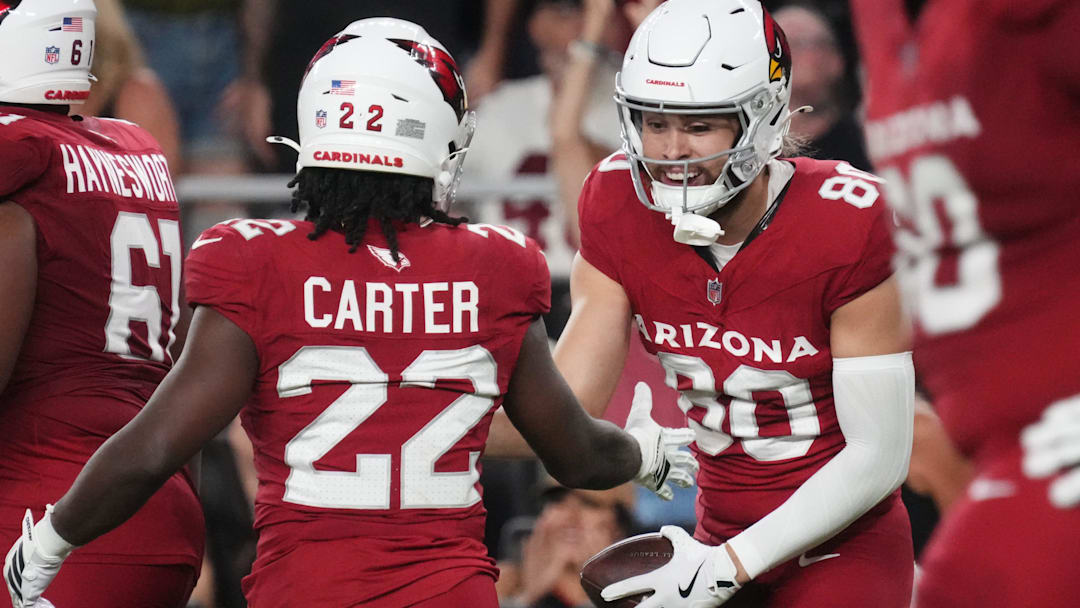 Arizona Cardinals receiver Simi Fehoko (80) celebrates his touchdown catch with teammate Michael Carter (22) as they play against the Las Vegas Raiders at State Farm Stadium in Glendale, on Aug. 23, 2025.
