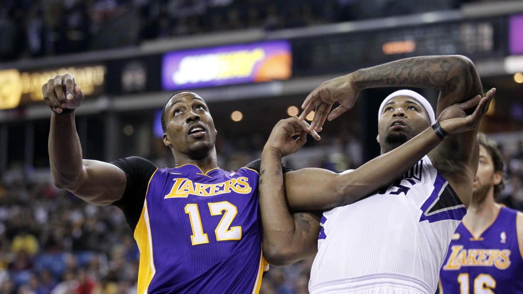 Mar 30, 2013; Sacramento, CA, USA; Los Angeles Lakers center Dwight Howard (12) and Sacramento Kings center DeMarcus Cousins (15) battle for position in the first quarter at Sleep Train Arena. Mandatory Credit: Cary Edmondson-USA TODAY Sports