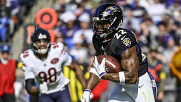 Oct 26, 2025; Baltimore, Maryland, USA; Baltimore Ravens running back Derrick Henry (22) rushes during the game against the Chicago Bears  at M&T Bank Stadium. Mandatory Credit: Tommy Gilligan-Imagn Images