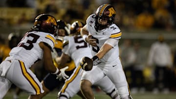 Sep 13, 2025; Berkeley, California, USA; Minnesota Golden Gophers quarterback Drake Lindsey (5) hands off to running back Cam Davis (23) during the first quarter  against the California Golden Bears at California Memorial Stadium. Mandatory Credit: D. Ross Cameron-Imagn Images