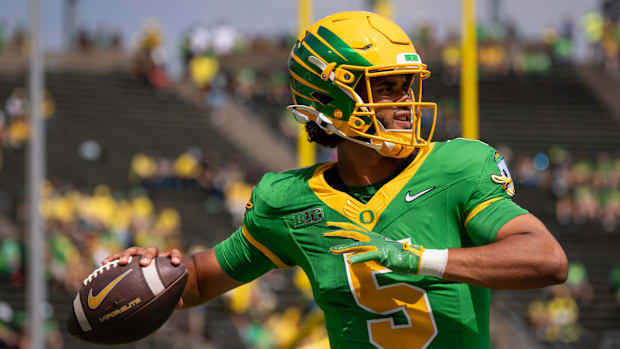Oregon quarterback Dante Moore throws a pass during warmups as the Oregon Ducks host the Montana State Bobcats on Aug. 30, 20