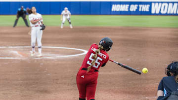 May 29, 2025; Oklahoma City, OK, USA;  Texas Tech Red Raiders utility Bailey Lindemuth (55) hits the ball to first base for an out in the third inning against the Ole Miss Rebels during the NCAA Softball Women's College World Series at Devon Park. Mandatory Credit: Brett Rojo-Imagn Images