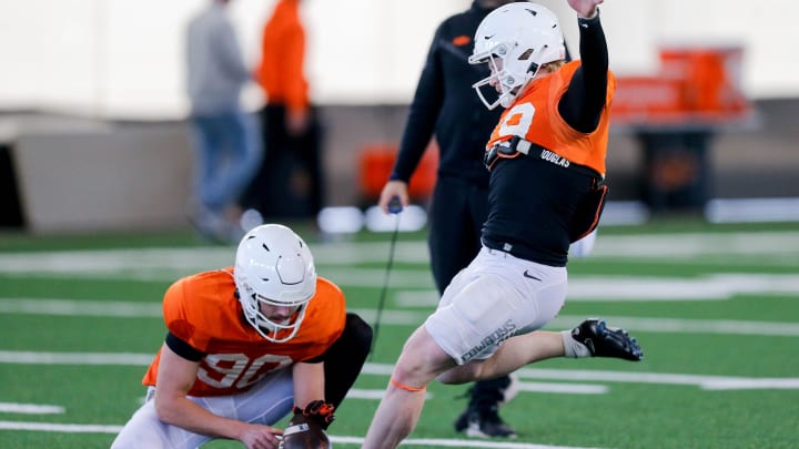 Logan Ward (19) runs drills during a Oklahoma State football practice, in Stillwater, Okla., on Tuesday, April 2, 2024.