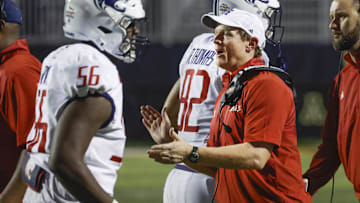 Sep 19, 2024; Boone, North Carolina, USA;  South Alabama Jaguars head coach Major Applewhite claps after a score as South Alabama Jaguars offensive lineman Adrian Griffin (56) and tight end Trent Thomas (82) return to the bench during the second half against the Appalachian State Mountaineers at Kidd Brewer Stadium. Mandatory Credit: Reinhold Matay-Imagn Images