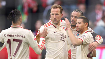 Harry Kane celebrating with Bayern Munich teammates after scoring his 22nd goal of the Bundesliga campaign.
