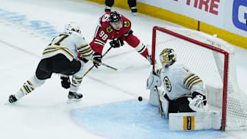 Oct 24, 2023; Chicago, Illinois, USA; Boston Bruins goaltender Jeremy Swayman (1) makes a save on Chicago Blackhawks center Connor Bedard (98) during the second period at United Center. Mandatory Credit: David Banks-Imagn Images