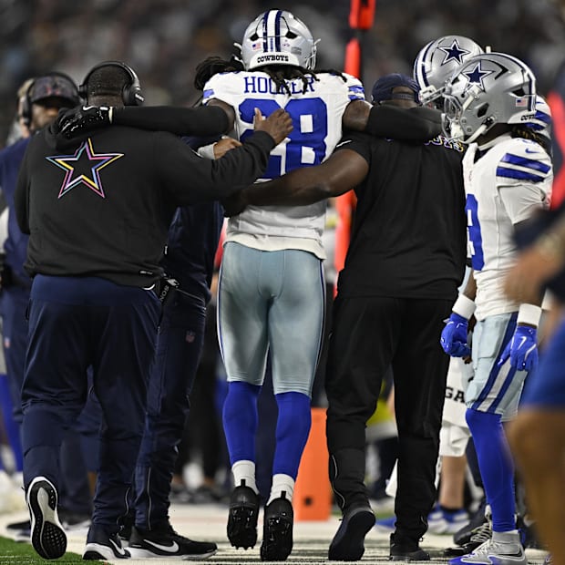 Dallas Cowboys safety Malik Hooker is helped off the field in the second quarter against the Green Bay Packers