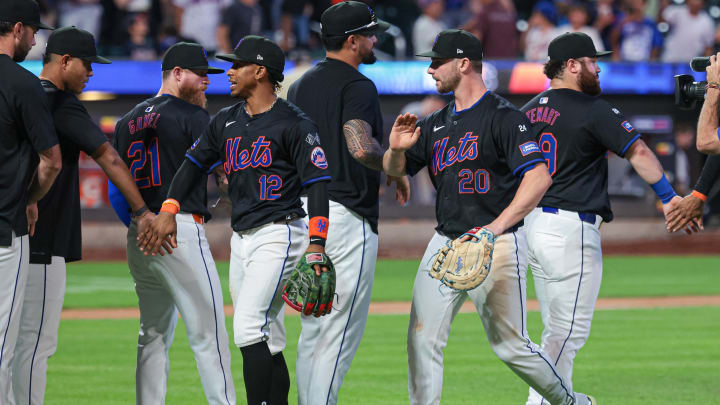 Jul 26, 2024; New York City, New York, USA;  New York Mets first baseman Pete Alonso (20) and shortstop Francisco Lindor (12) celebrates with teammates after the game against the Atlanta Braves at Citi Field. Mandatory Credit: Vincent Carchietta-USA TODAY Sports