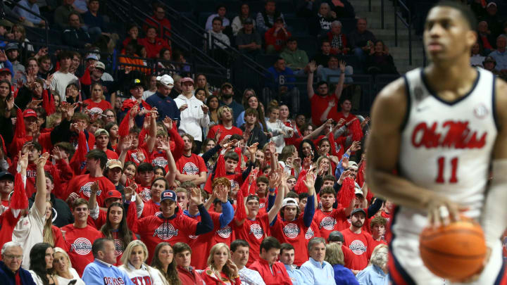 Feb 28, 2024; Oxford, Mississippi, USA; Mississippi Rebels fans hold their hands up as guard Matthew Murrell (11) shoots a free throw during the second half against the Alabama Crimson Tide at The Sandy and John Black Pavilion at Ole Miss. Mandatory Credit: Petre Thomas-USA TODAY Sports