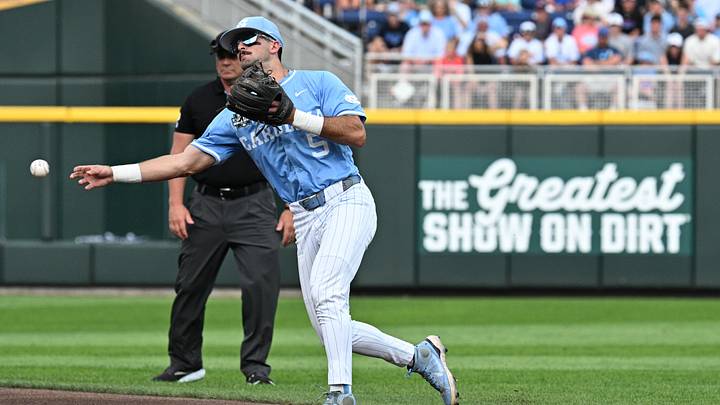 Jun 12, 2026; Omaha, NE, USA;  North Carolina Tar Heels second baseman Gavin Gallaher (5) makes a play to first base against the Mississippi Rebels during the first inning at Charles Schwab Field. Mandatory Credit: Steven Branscombe-Imagn Images