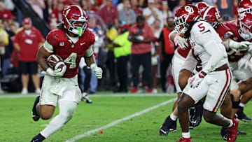 Alabama Crimson Tide running back Daniel Hill (4) runs the ball against Oklahoma Sooners linebacker Kendal Daniels (5)