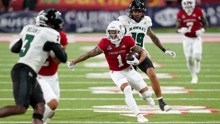 Nov 5, 2022; Fresno, California, USA; Fresno State Bulldogs wide receiver Nikko Remigio (1) runs with the bal after making a catch against the Hawaii Rainbow Warriors in the first quarter at Valley Children's Stadium. Mandatory Credit: Cary Edmondson-USA TODAY Sports