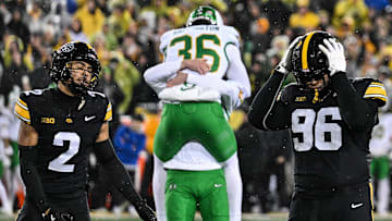 Nov 8, 2025; Iowa City, Iowa, USA; Iowa Hawkeyes defensive back TJ Hall (2) and defensive lineman Bryce Hawthorne (96) react after Oregon Ducks kicker Atticus Sappington (36) kicks the game winning field near the end of the fourth quarter at Kinnick Stadium. Mandatory Credit: Jeffrey Becker-Imagn Images