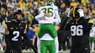 Nov 8, 2025; Iowa City, Iowa, USA; Iowa Hawkeyes defensive back TJ Hall (2) and defensive lineman Bryce Hawthorne (96) react after Oregon Ducks kicker Atticus Sappington (36) kicks the game winning field near the end of the fourth quarter at Kinnick Stadium. Mandatory Credit: Jeffrey Becker-Imagn Images