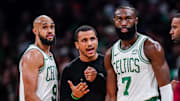 Dec 14, 2023; Boston, Massachusetts, USA; Boston Celtics head coach Joe Mazzulla talks with guard Jaylen Brown (7) and guard Derrick White (9) from the sideline as they take on the Cleveland Cavaliers at TD Garden. Mandatory Credit: David Butler II-Imagn Images