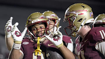 Oct 5, 2024; Tallahassee, Florida, USA; Florida State Seminoles wide receiver Ja'Khi Douglas (0) celebrates with quarterback Brock Glenn (11) after a touchdown against the Clemson Tigers during the second half at Doak S. Campbell Stadium. Mandatory Credit: Melina Myers-Imagn Images