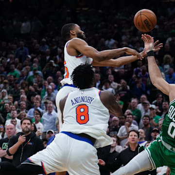 May 7, 2025; Boston, Massachusetts, USA; New York Knicks forward Mikal Bridges (25) defends against Boston Celtics forward Jayson Tatum (0) in the last seconds of the fourth quarter during game two of the second round for the 2025 NBA Playoffs at TD Garden. Mandatory Credit: David Butler II-Imagn Images