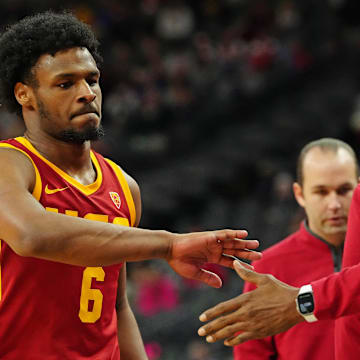 Mar 13, 2024; Las Vegas, NV, USA; USC Trojans guard Bronny James (6) returns to the bench in a game against the Washington Huskies during the second half at T-Mobile Arena. Mandatory Credit: Stephen R. Sylvanie-Imagn Images