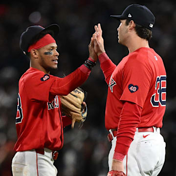 Sep 6, 2024; Boston, Massachusetts, USA; Boston Red Sox first baseman Triston Casas (36) high-fives shortstop Ceddanne Rafaela (43) after a game against the Chicago White Sox at Fenway Park. Mandatory Credit: Brian Fluharty-Imagn Images