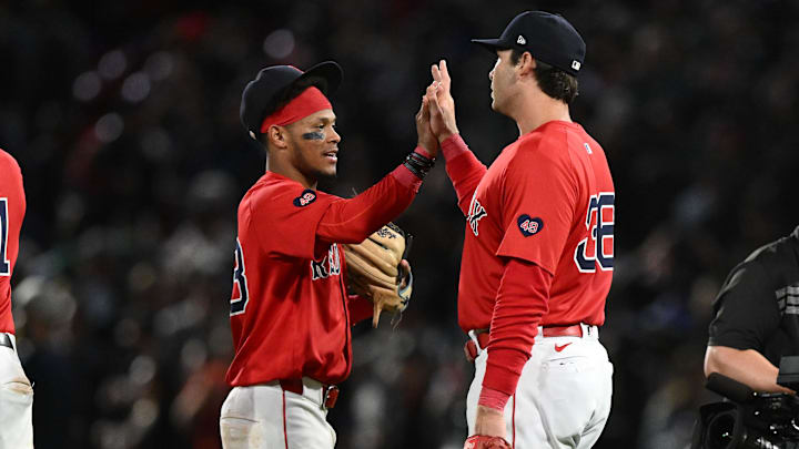 Sep 6, 2024; Boston, Massachusetts, USA; Boston Red Sox first baseman Triston Casas (36) high-fives shortstop Ceddanne Rafaela (43) after a game against the Chicago White Sox at Fenway Park. Mandatory Credit: Brian Fluharty-Imagn Images