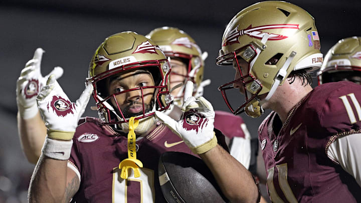Oct 5, 2024; Tallahassee, Florida, USA; Florida State Seminoles wide receiver Ja'Khi Douglas (0) celebrates with quarterback Brock Glenn (11) after a touchdown against the Clemson Tigers during the second half at Doak S. Campbell Stadium. Mandatory Credit: Melina Myers-Imagn Images Oct 5, 2024; Tallahassee, Florida, USA; Florida State Seminoles wide receiver Ja'Khi Douglas (0) celebrates with quarterback Brock Glenn (11) after a touchdown against the Clemson Tigers during the second half at Doak S. Campbell Stadium. Mandatory Credit: Melina Myers-Imagn Images