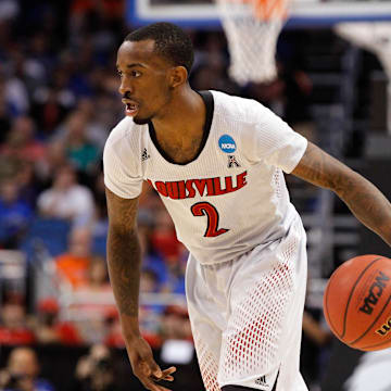 Mar 22, 2014; Orlando, FL, USA; Louisville Cardinals guard Russ Smith (2) drives to the basket against the Saint Louis Billikens in the first half of a men's college basketball game during the third round of the 2014 NCAA Tournament at Amway Center. Mandatory Credit: Kim Klement-Imagn Images