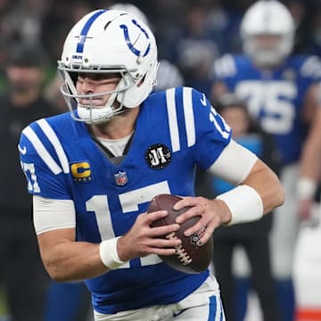 Nov 9, 2025; Berlin, Germany; Indianapolis Colts quarterback Daniel Jones (17) runs the ball against the Atlanta Falcons during the NFL Berlin Game at Olympic Stadium. Mandatory Credit: Kirby Lee-Imagn Images