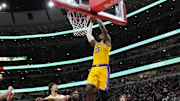 Mar 27, 2025; Chicago, Illinois, USA; Los Angeles Lakers forward LeBron James (23) dunks on Chicago Bulls forward Patrick Williams (44) during the second half at United Center. Mandatory Credit: David Banks-Imagn Images