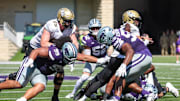 Sep 27, 2025; Manhattan, Kansas, USA; UCF Knights quarterback Tayven Jackson (2) tries to get away from Kansas State Wildcats defensive tackles Malcolm Alcorn-Crowder (55) and Uso Seumalo (99) during the third quarter at Bill Snyder Family Football Stadium. Mandatory Credit: Scott Sewell-Imagn Images