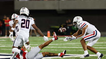 Aug 31, 2024; Tucson, Arizona, USA; Arizona Wildcats defensive back Treydan Stukes (2) catches interception from New Mexico Lobos quarterback Devon Dampier (4) during third quarter at Arizona Stadium. Mandatory Credit: Aryanna Frank-Imagn Images