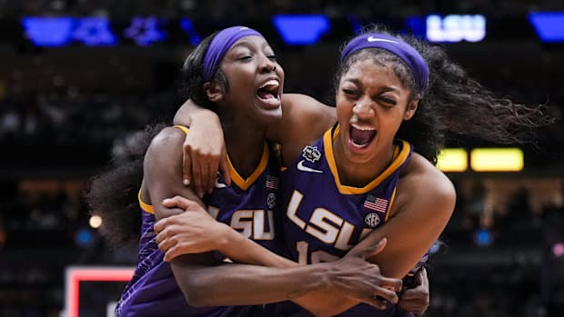 LSU Lady Tigers guard Flau'jae Johnson, left, celebrates with forward Angel Reese after defeating the Virginia Tech Hokies