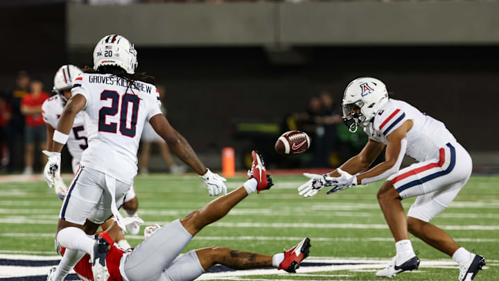 Aug 31, 2024; Tucson, Arizona, USA; Arizona Wildcats defensive back Treydan Stukes (2) catches interception from New Mexico Lobos quarterback Devon Dampier (4) during third quarter at Arizona Stadium. Mandatory Credit: Aryanna Frank-Imagn Images