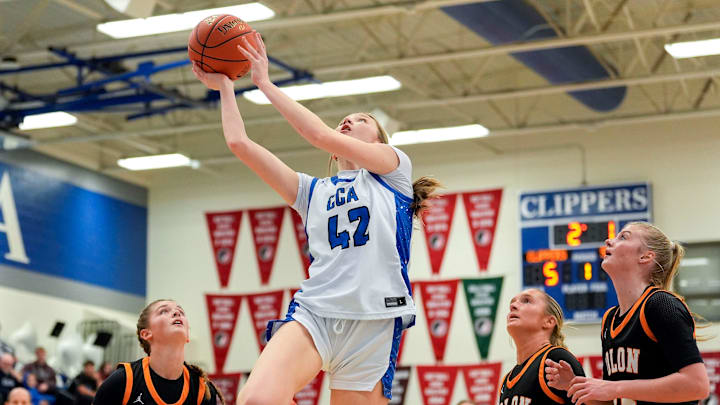 Clear Creek Amana’s Bailey Simpson (42) drives to the basketball Dec. 5, 2025 during a girls basketball game against the Solon Spartans in Tiffin, Iowa.