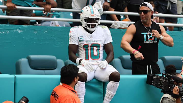 Miami Dolphins wide receiver Tyreek Hill sits on the stands after a run against the Arizona Cardinals on Oct 27, 2024.