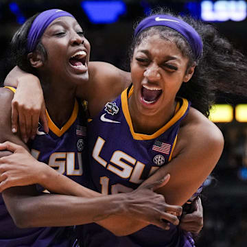 Mar 31, 2023; Dallas, TX, USA; LSU Lady Tigers guard Flau'jae Johnson, left, celebrates with forward Angel Reese after defeating the Virginia Tech Hokies in semifinals of the women's Final Four of the 2023 NCAA Tournament at American Airlines Center. Mandatory Credit: Kirby Lee-Imagn Images