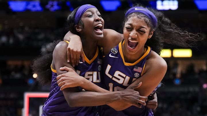 Mar 31, 2023; Dallas, TX, USA; LSU Lady Tigers guard Flau'jae Johnson, left, celebrates with forward Angel Reese after defeating the Virginia Tech Hokies in semifinals of the women's Final Four of the 2023 NCAA Tournament at American Airlines Center. Mandatory Credit: Kirby Lee-Imagn Images