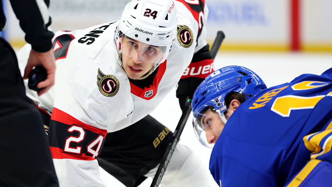 Mar 25, 2025; Buffalo, New York, USA;  Ottawa Senators center Dylan Cozens (24) waits for a face-off between Buffalo Sabres center Peyton Krebs (19) during the first period at KeyBank Center. Mandatory Credit: Timothy T. Ludwig-Imagn Images