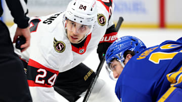 Mar 25, 2025; Buffalo, New York, USA;  Ottawa Senators center Dylan Cozens (24) waits for a face-off between Buffalo Sabres center Peyton Krebs (19) during the first period at KeyBank Center. Mandatory Credit: Timothy T. Ludwig-Imagn Images