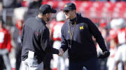 Nov 26, 2022; Columbus, Ohio, USA; Michigan Wolverines head coach Jim Harbaugh (right) and Ohio State Buckeyes head coach Ryan Day (left) shake hands before the game at Ohio Stadium.