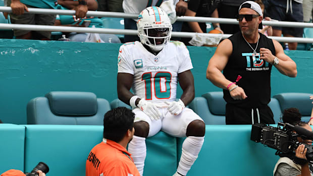 Miami Dolphins wide receiver Tyreek Hill (10) sits on the stands