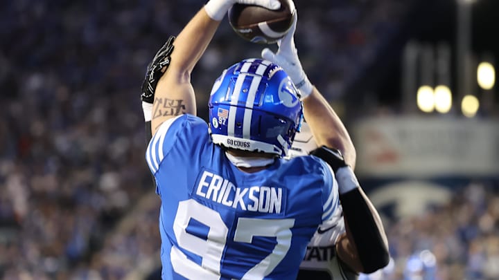 Sep 29, 2022; Provo, Utah, USA; Brigham Young Cougars tight end Ethan Erickson (97) goes up for a catch in the end zone against Utah State Aggies linebacker Kaleo Neves (23) in the third quarter at LaVell Edwards Stadium. Mandatory Credit: Rob Gray-Imagn Images