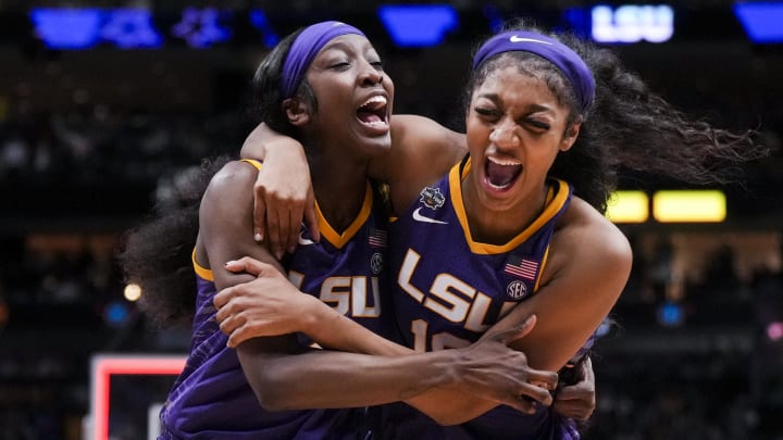 LSU Lady Tigers guard Flau'jae Johnson celebrates with forward Angel Reese after defeating the Virginia Tech Hokies in semifinals of the women's Final Four of the 2023 NCAA Tournament at American Airlines Center.