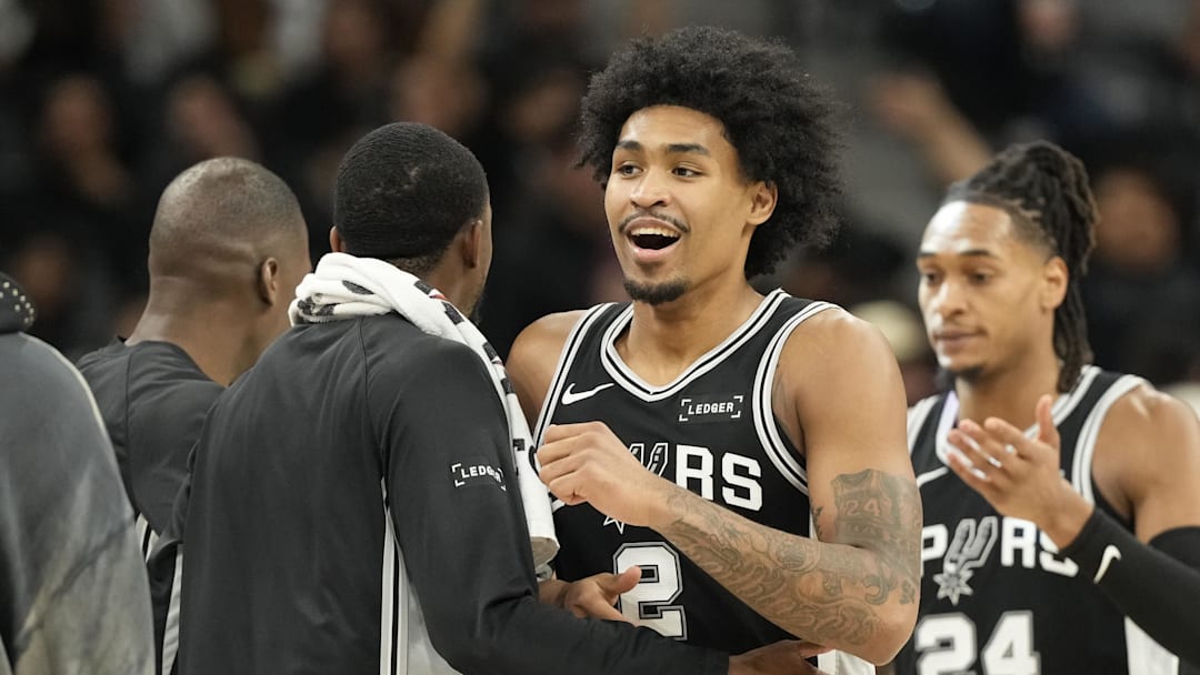 Dec 2, 2025; San Antonio, Texas, USA; San Antonio Spurs guard Dylan Harper (2) is congratulated by teammates after scoring before a timeout in the second half against the Memphis Grizzlies at Frost Bank Center. Mandatory Credit: Scott Wachter-Imagn Images Dec 2, 2025; San Antonio, Texas, USA; San Antonio Spurs guard Dylan Harper (2) is congratulated by teammates after scoring before a timeout in the second half against the Memphis Grizzlies at Frost Bank Center. Mandatory Credit: Scott Wachter-Imagn Images