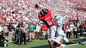 Sep 14, 2024; Lubbock, Texas, USA;  Texas Tech Red Raiders wide receiver Caleb Douglas (5) battles for a pass against North Texas Mean Green defensive safety Taylor Starling (17) in the first half at Jones AT&T Stadium and Cody Campbell Field. Mandatory Credit: Michael C. Johnson-Imagn Images