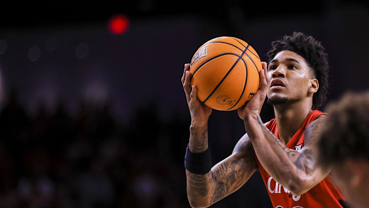Mar 5, 2025; Cincinnati, Ohio, USA; Cincinnati Bearcats forward Dillon Mitchell (23) shoots a free throw against the Kansas State Wildcats in the first half at Fifth Third Arena. Mandatory Credit: Katie Stratman-Imagn Images