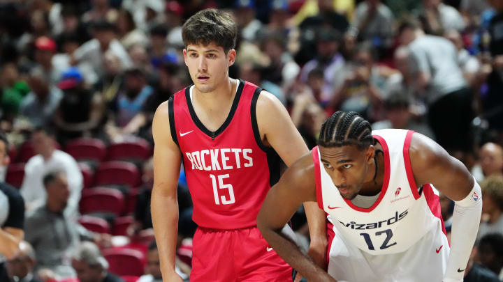 Jul 14, 2024; Las Vegas, NV, USA; Houston Rockets guard Reed Sheppard (15) and Washington Wizards forward Alex Sarr (12) await a free throw attempt during the second quarter at Thomas & Mack Center. Mandatory Credit: Stephen R. Sylvanie-USA TODAY Sports